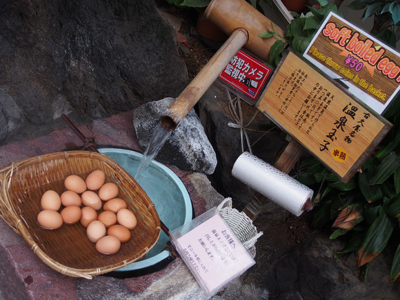 Onsen (hot spring) water cooking eggs at front door.