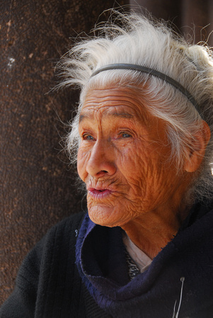 Old woman near plaza in Cuzco