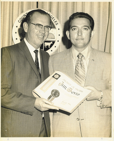 Jim Bevis receiving an award from Kenneth Hahn, Los Angeles County councilman